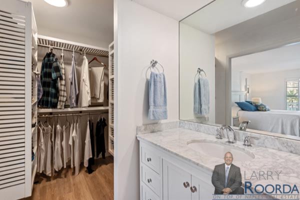 Bathroom and closet area of waterfront Breakers Condo for sale in Naples, FL