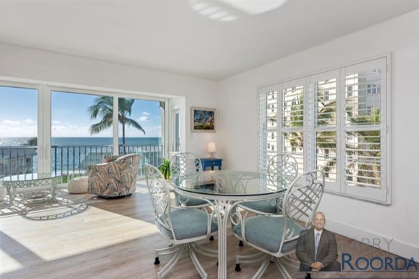 Casual dining with view of water at Breakers Condo for sale in Naples, FL