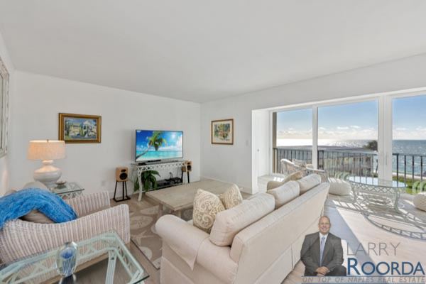 Living room of waterfront Breakers Condo for sale in Naples, FL