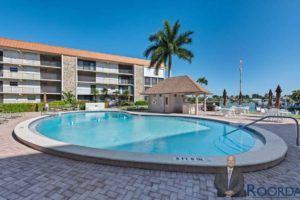 Outside canal-front pool at 900 Gulf Shore Blvd N, at the Bordeaux Club community.