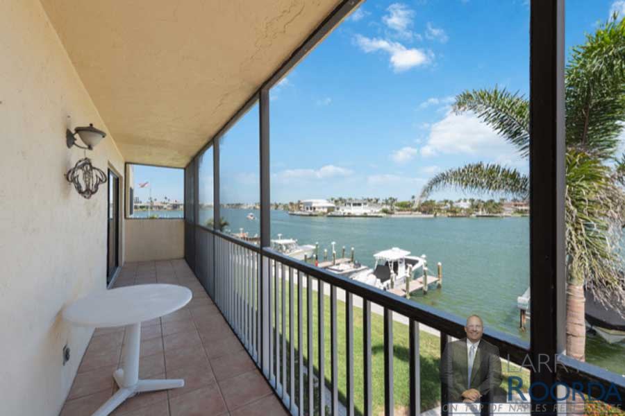 Long balcony with open bay views at Harbour Cove #216 The Moorings, Naples, FL. Larry Roorda Realtor.