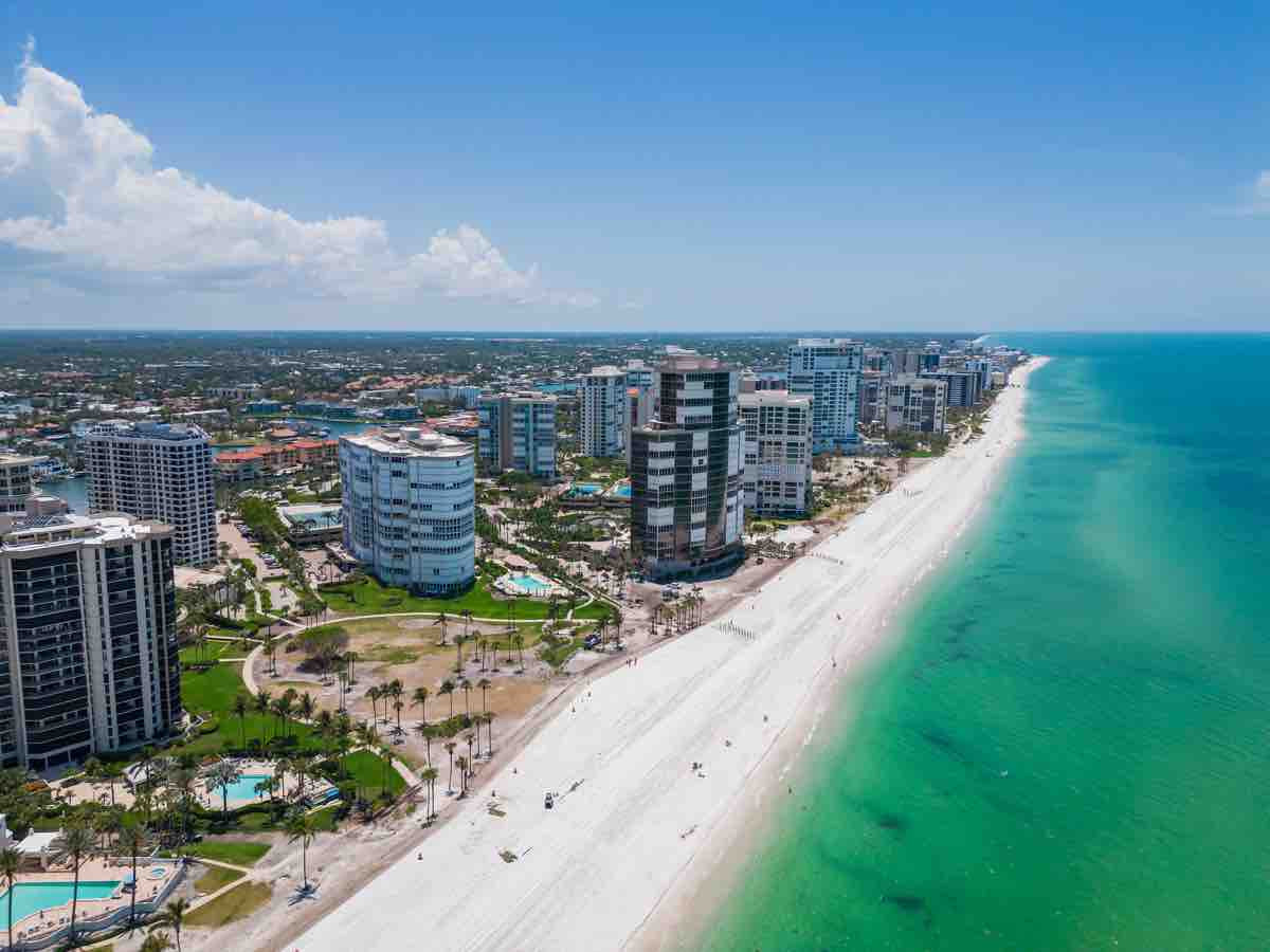Solamar. 4451 Gulf Shore Blvd N, Naples, FL Aerial from the beach